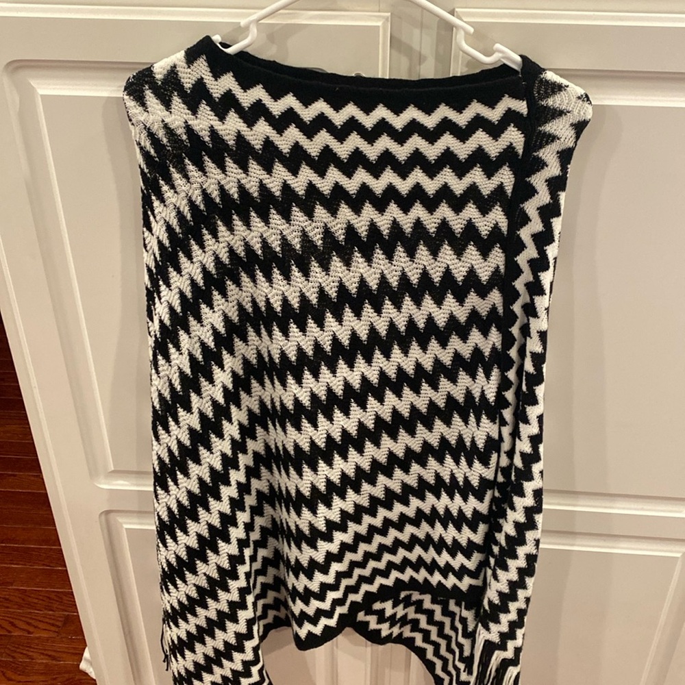 Tickled Pink poncho style sweater. Luke’s cute with leggings gas or black pants!